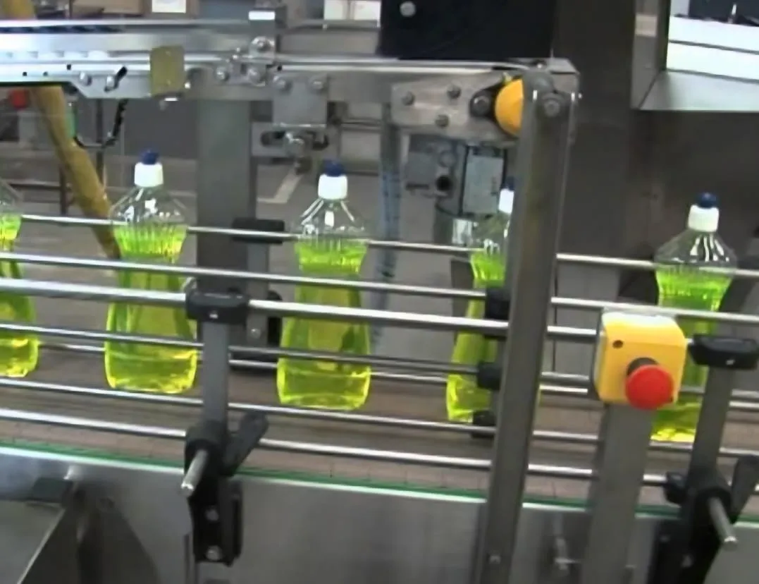 Dishwashing liquid bottles on the filling line